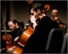 Cello player playing in an orchestra